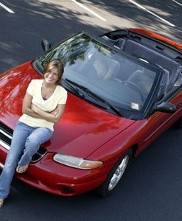 Woman Sitting on a Red Convertible in Houston, TX